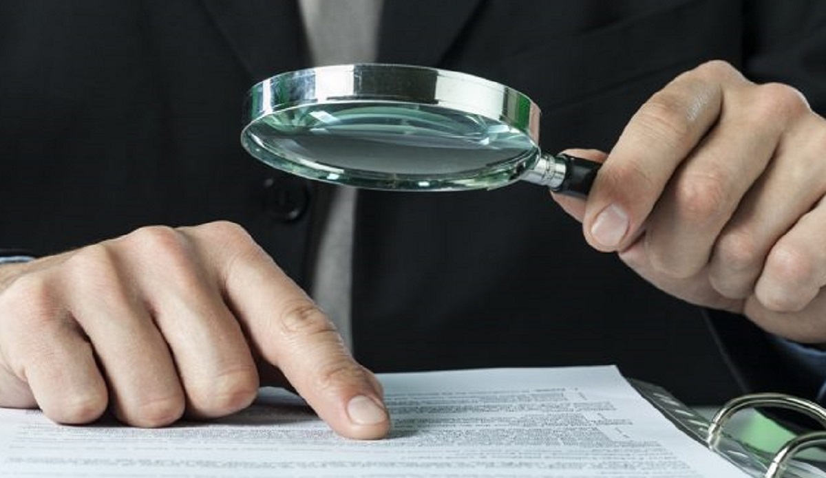 viewing a medical file with a magnifying glass